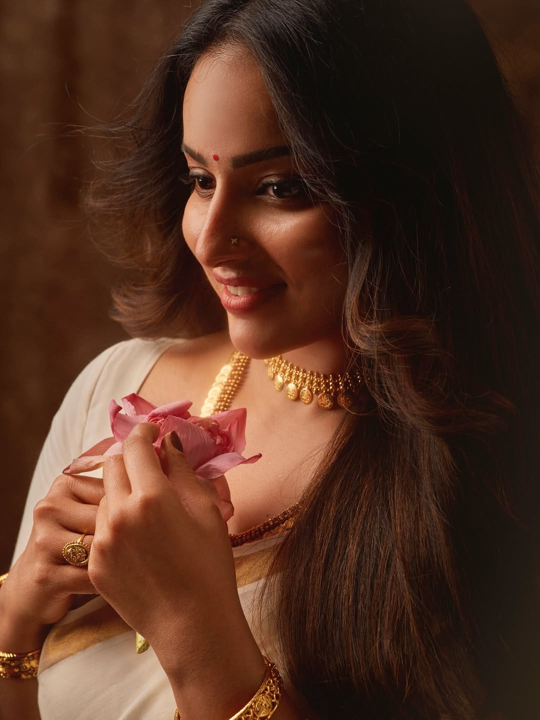 Malavika Menon shines in her festive Onam look.