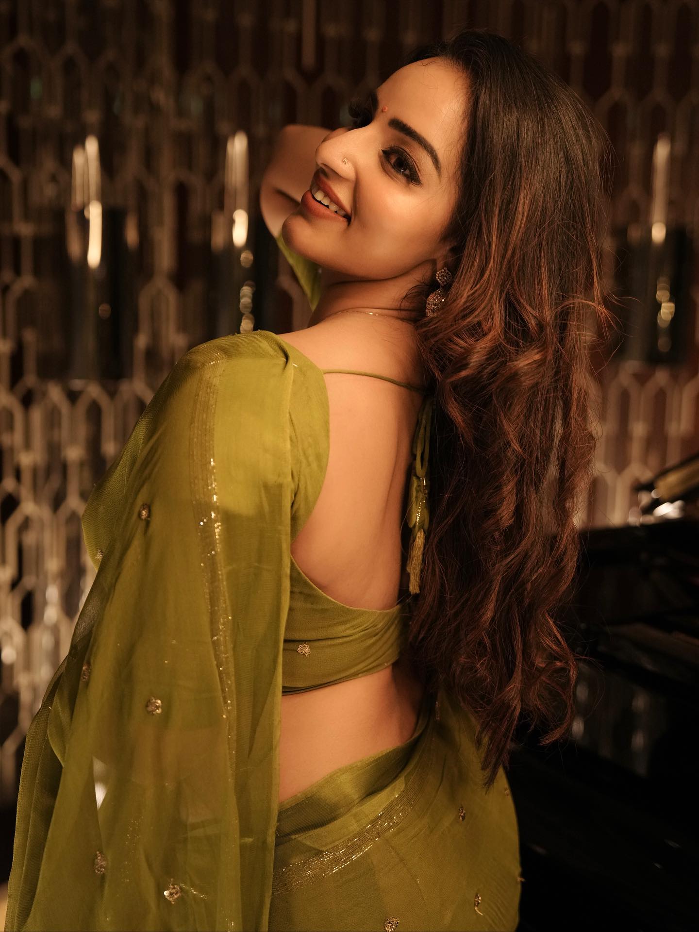 Malavika Menon's Soulful Gaze In Her Green Saree.