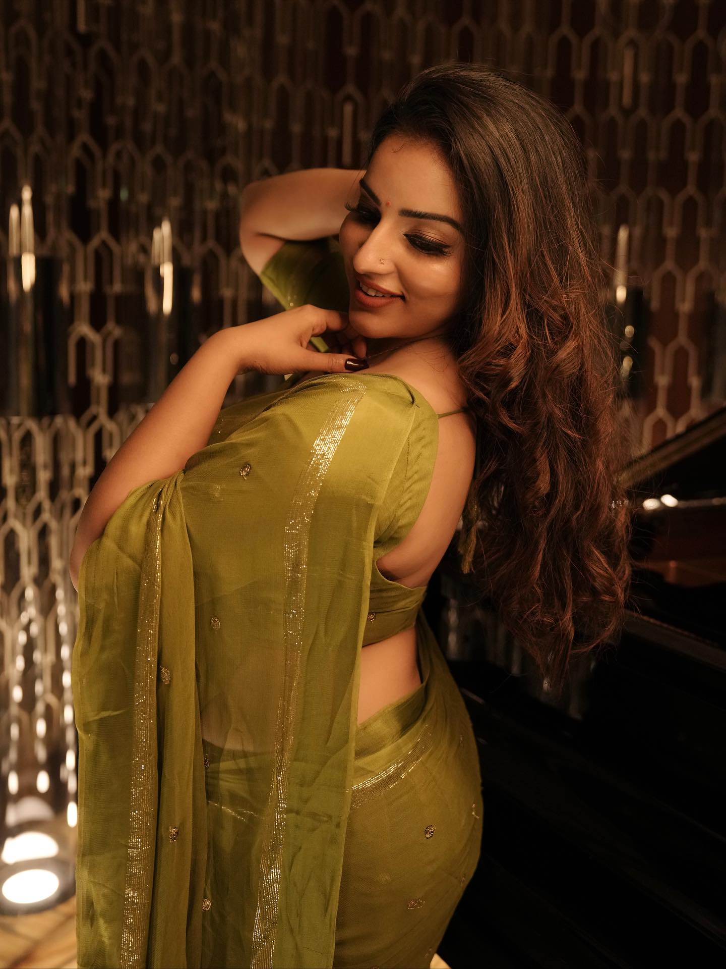 Malavika Menon Flaunts Her Toned Back In A Saree.