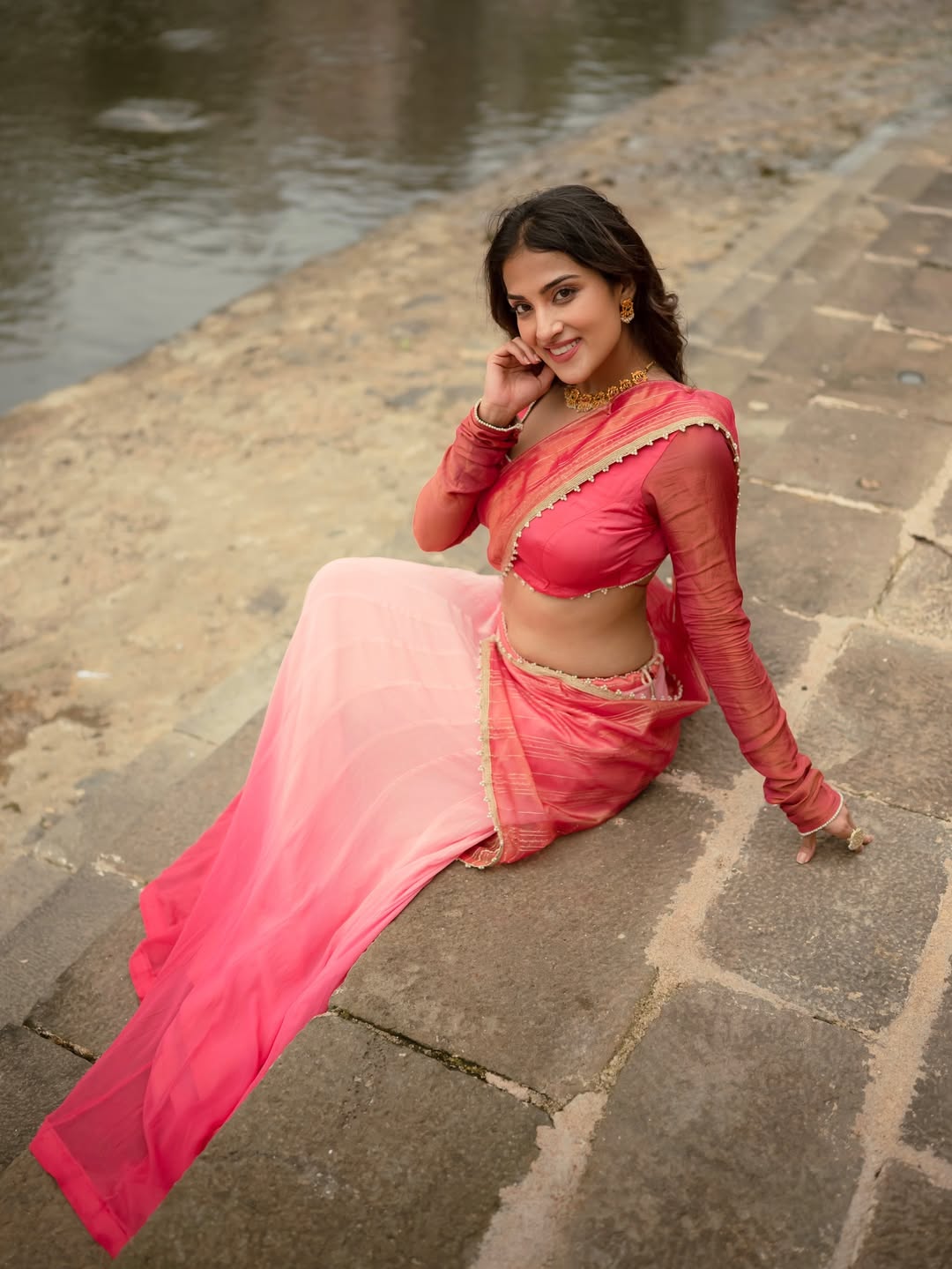 The actress captivates with a stunning side profile in her pink outfit.