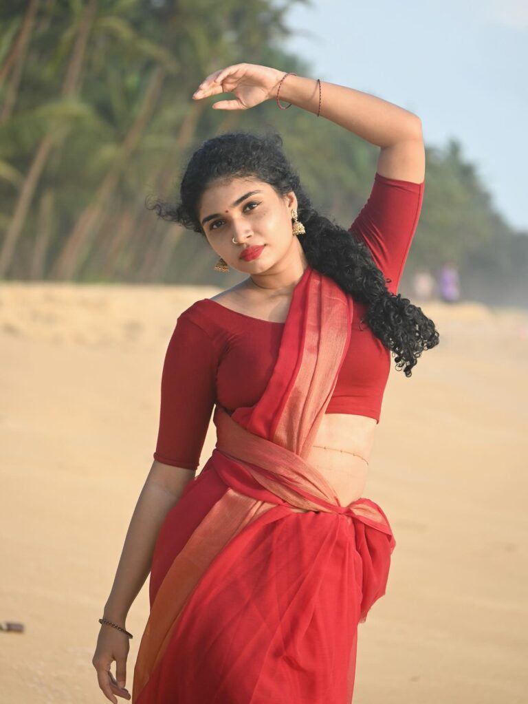 Neeraja looks ethereal standing gracefully by the water's edge.