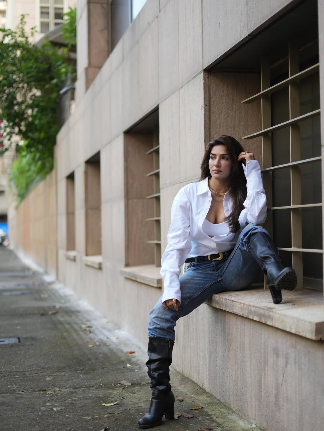 Neha Khan's Confident Pose On A Windowsill