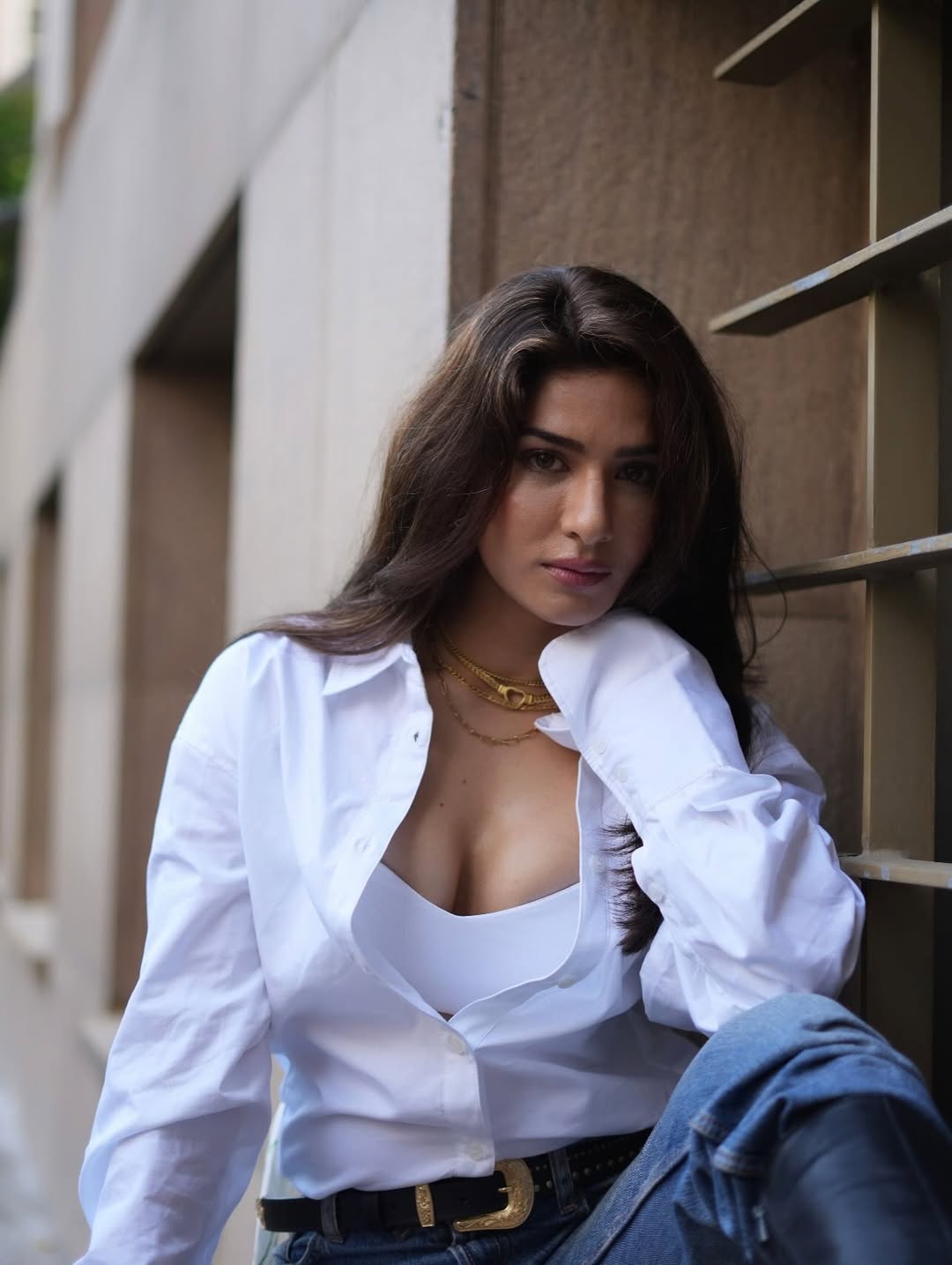 Neha Khan Leans Forward With A Seductive Gaze