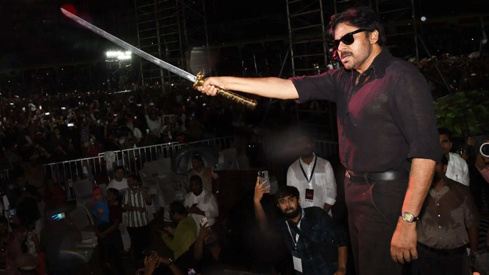 Pawan Kalyan fans watching OG movie trailer at event