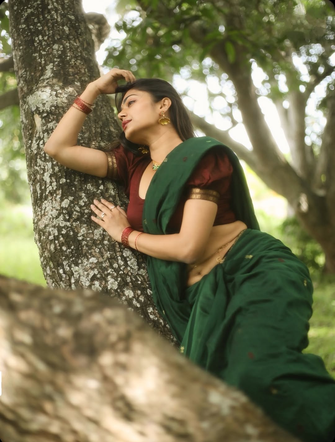 Payal Radhakrishna's Joyful Pose Against A Tree