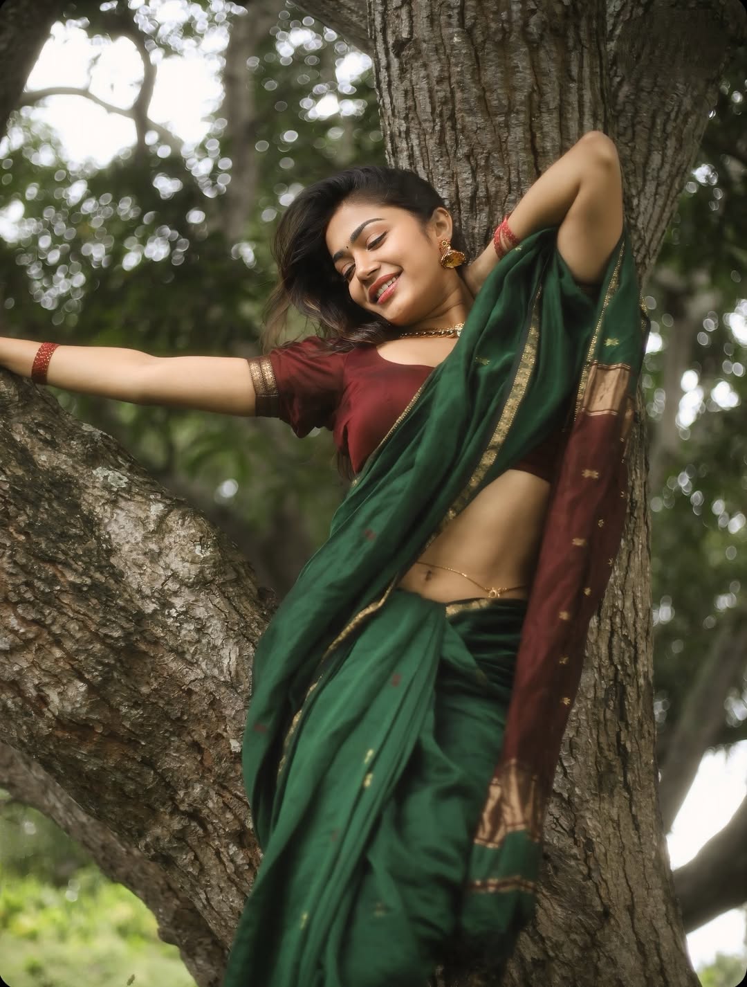 Payal Radhakrishna Leans On A Tree In A Saree