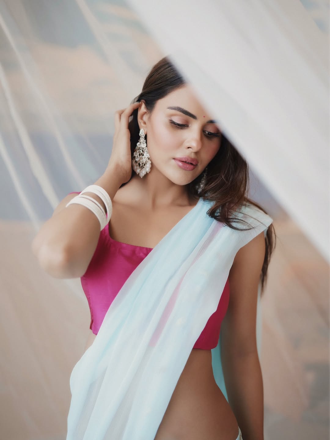 Priyanka Chahar Posing Behind A Sheer Curtain