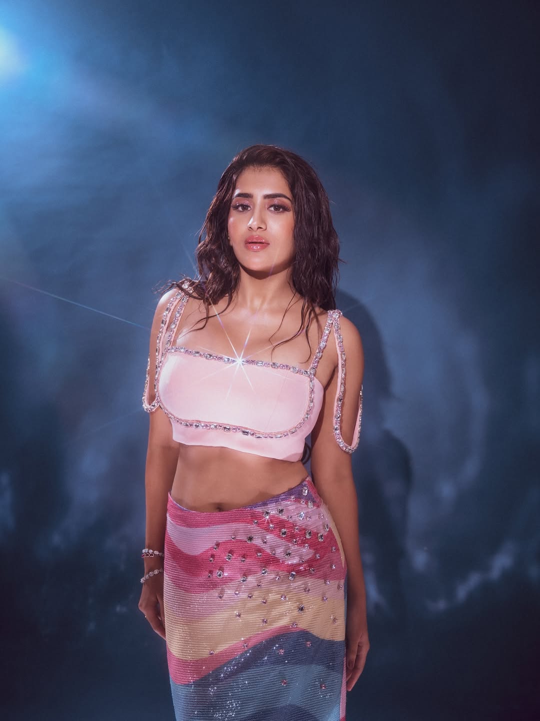 Actress Rashi Singh shows off her stunning curves in a colorful sequined skirt.