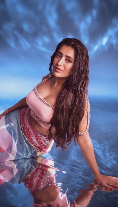 A close-up captures Rashi Singh's confident expression and stunning features.