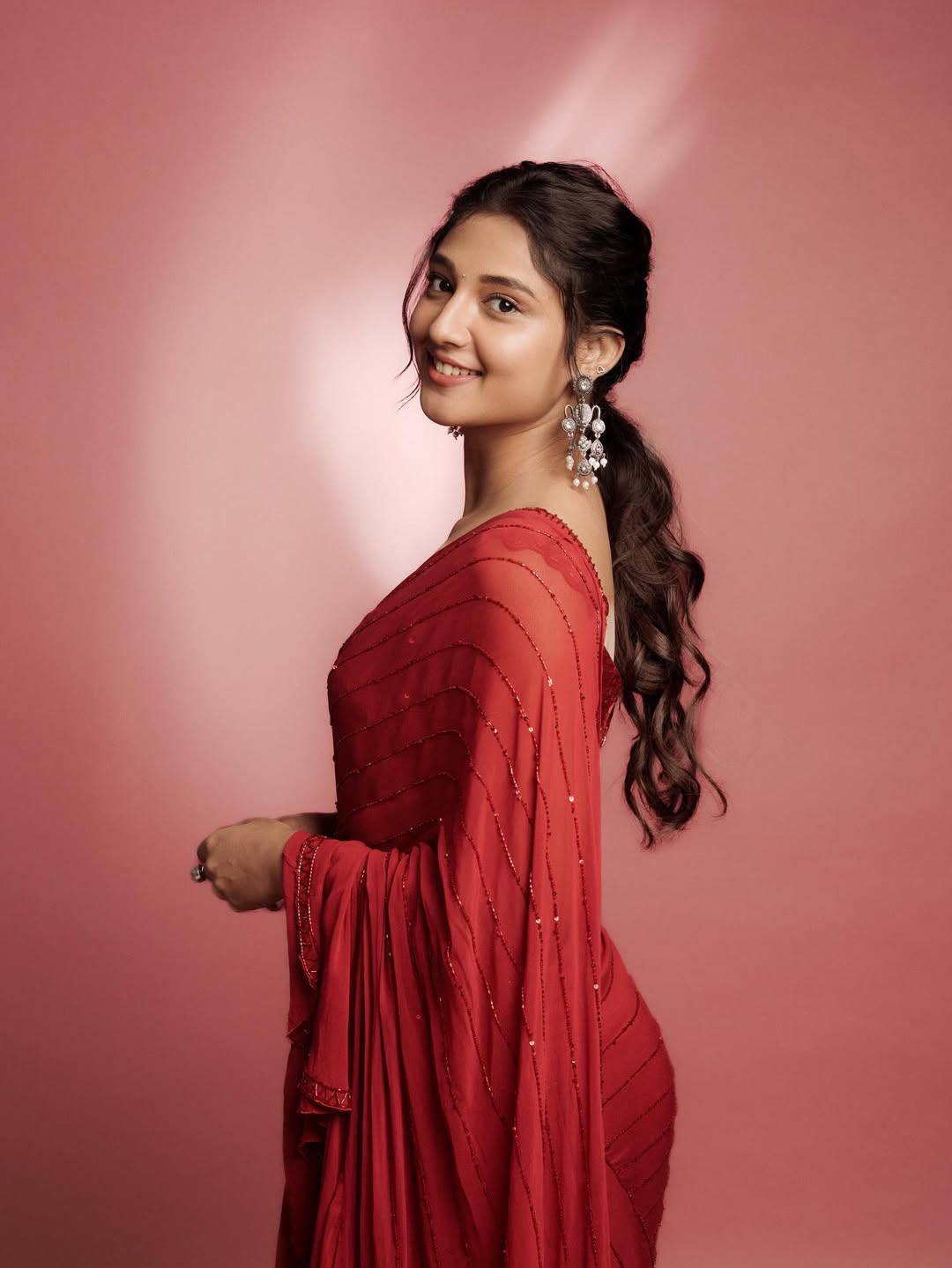 Bold and Beautiful: Ritika Nayak’s Red Saree Glam showcases her graceful beauty.