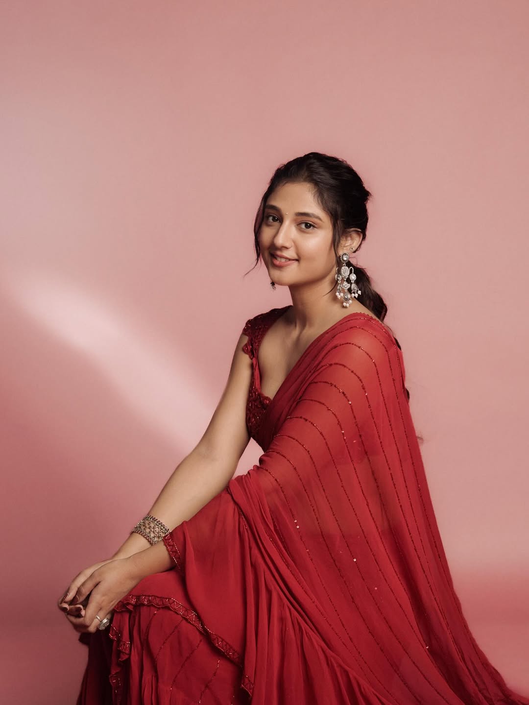 Bold and Beautiful: Ritika Nayak’s Red Saree Glam reveals glamorous, stylish presence.