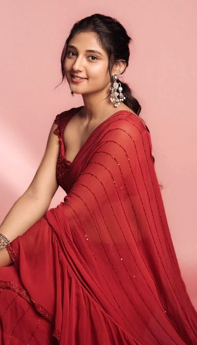 Bold and Beautiful: Ritika Nayak’s Red Saree Glam emphasizes poise and elegance.