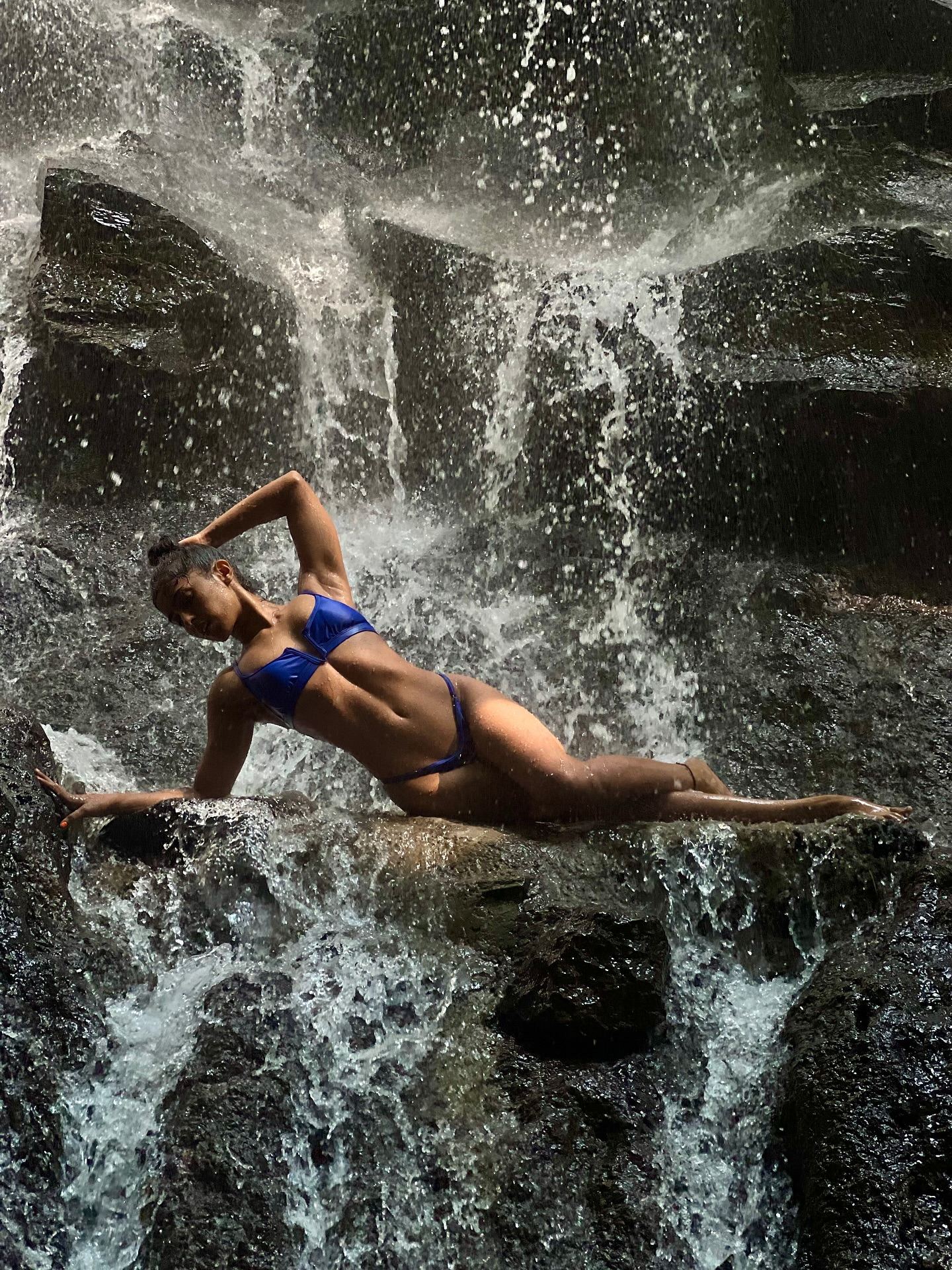 Samyuktha Lounges On Rocks Amidst The Waterfall