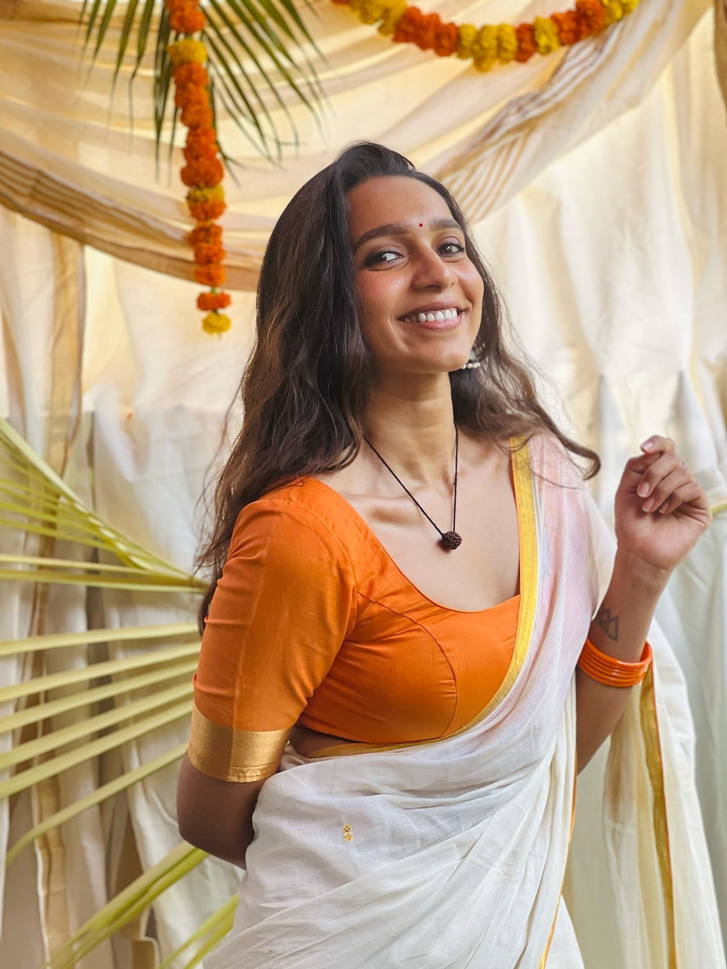 Sanchana Natarajan's bright and cheerful pose in her ethnic attire.