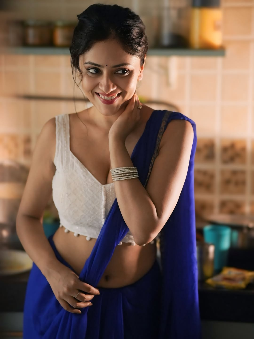 Sanya Thakur flashes a radiant smile in a stunning blue saree.
