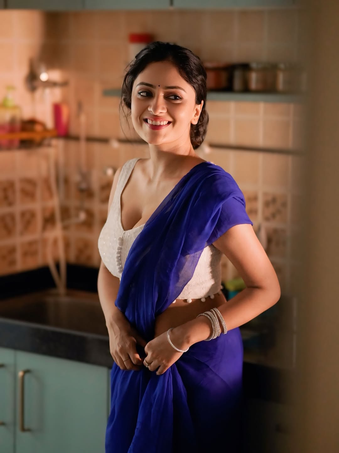 A close-up of Sanya Thakur’s playful and alluring expression.