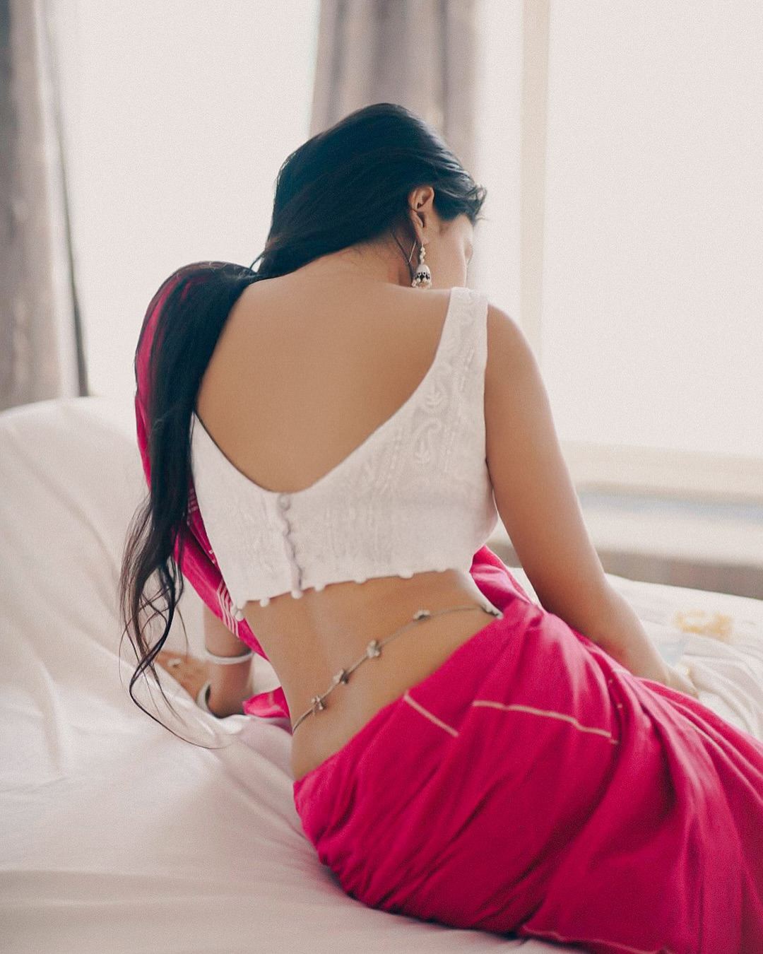 Sanya Thakur exudes grace and style with stunning slim waist.