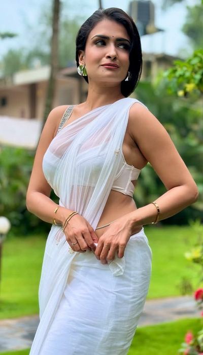 White Saree Magic by Urvashi Apsara sparkles with poise and beauty.