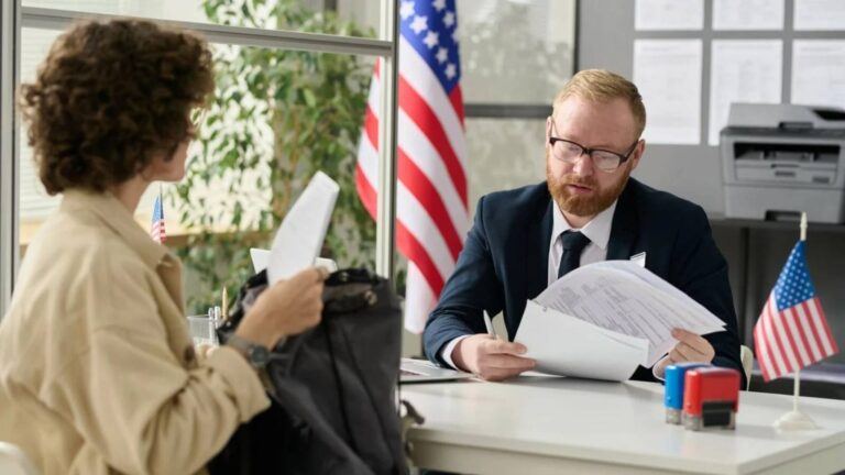 USCIS officer speaking with green card applicant