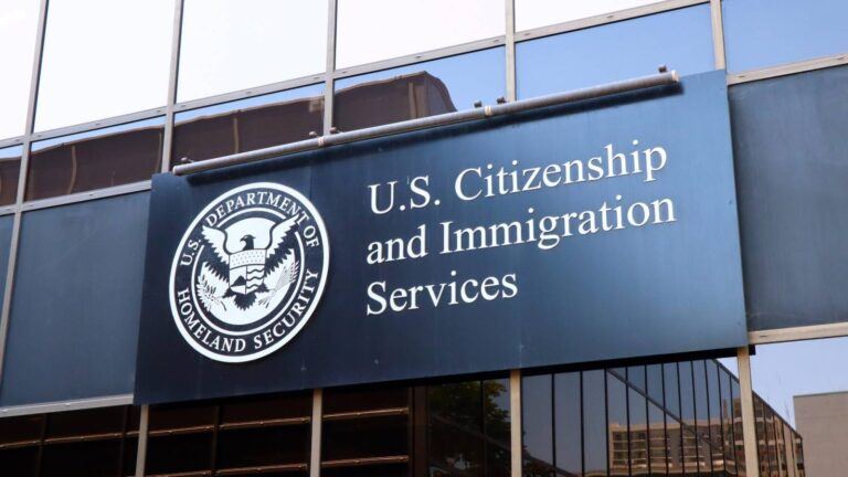 USCIS office with green card application forms