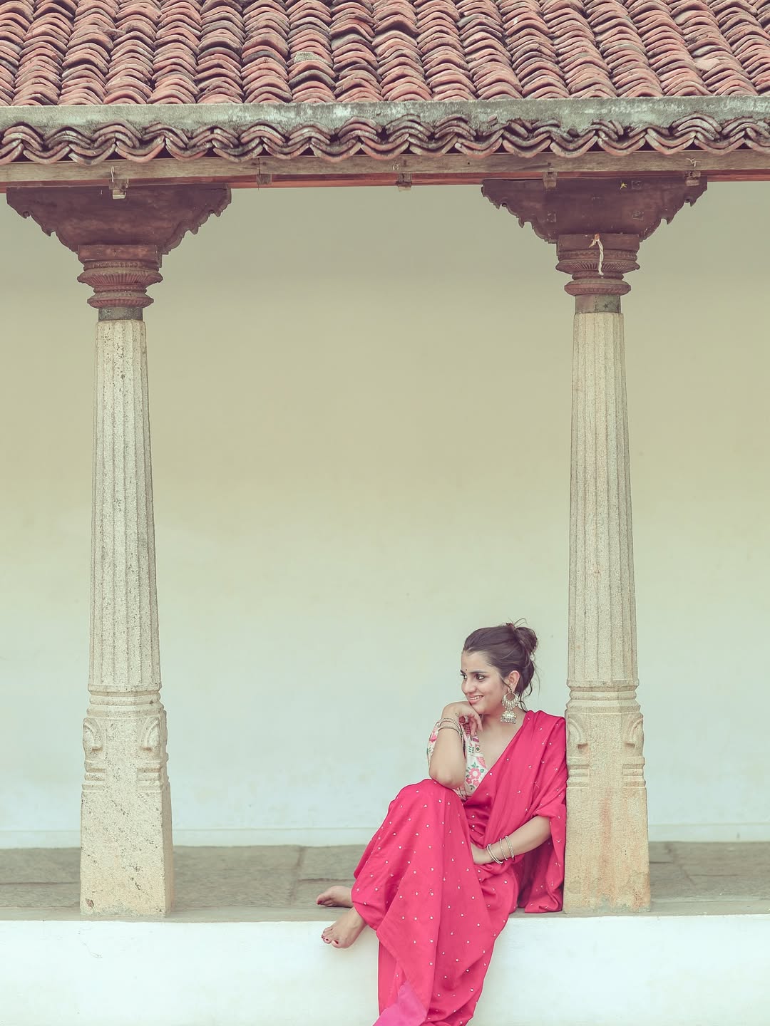 Utkarshica wears a lovely white flower in her hair for the shoot.