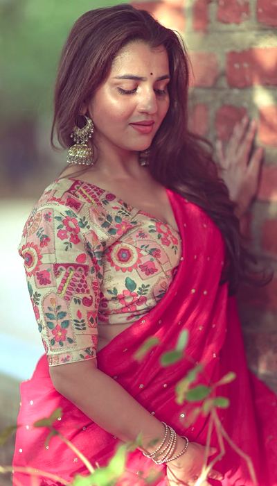 Close-up shot showcasing her gorgeous traditional jhumka earrings.