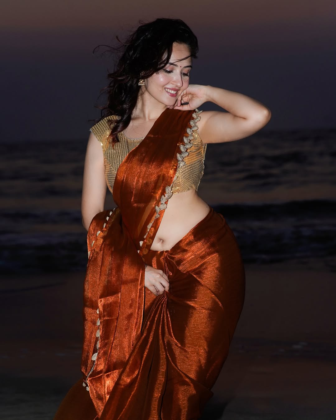 Varsha Rekhate Poses In A Saree At Sunset