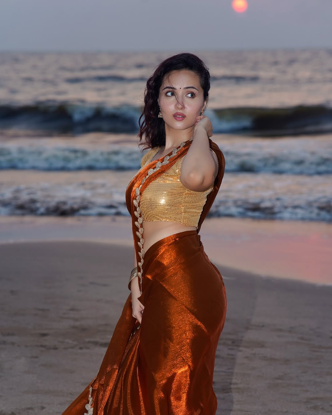 Varsha Rekhate In A Shimmering Copper Saree