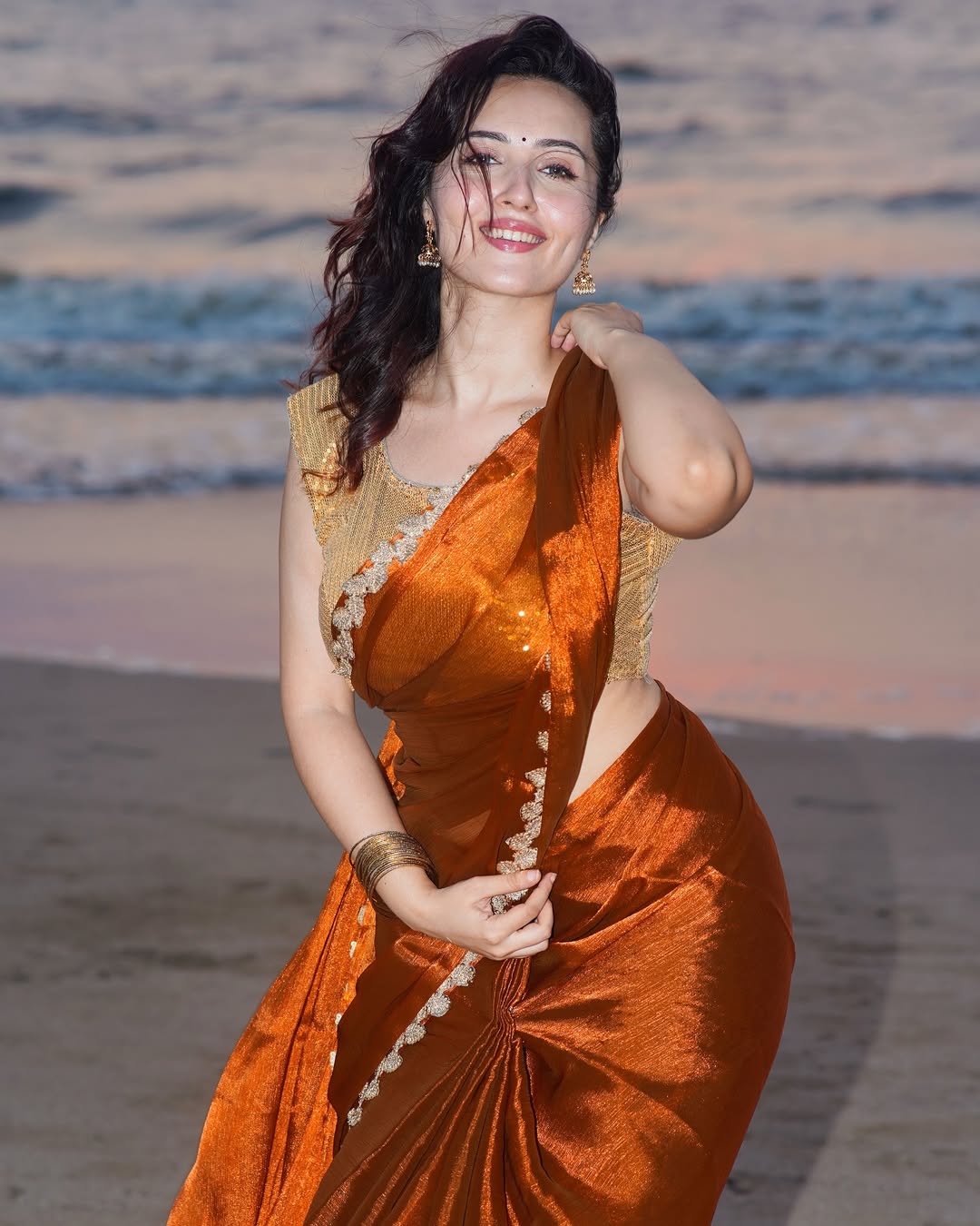 Varsha Flaunts Her Curves In A Golden Blouse