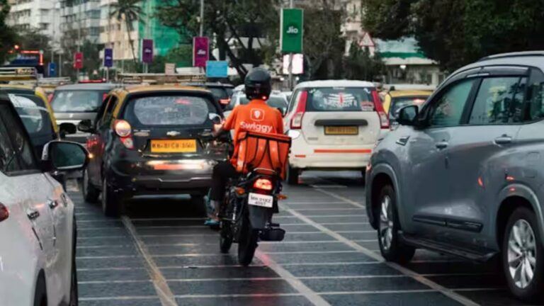 Delivery worker in Indian traffic