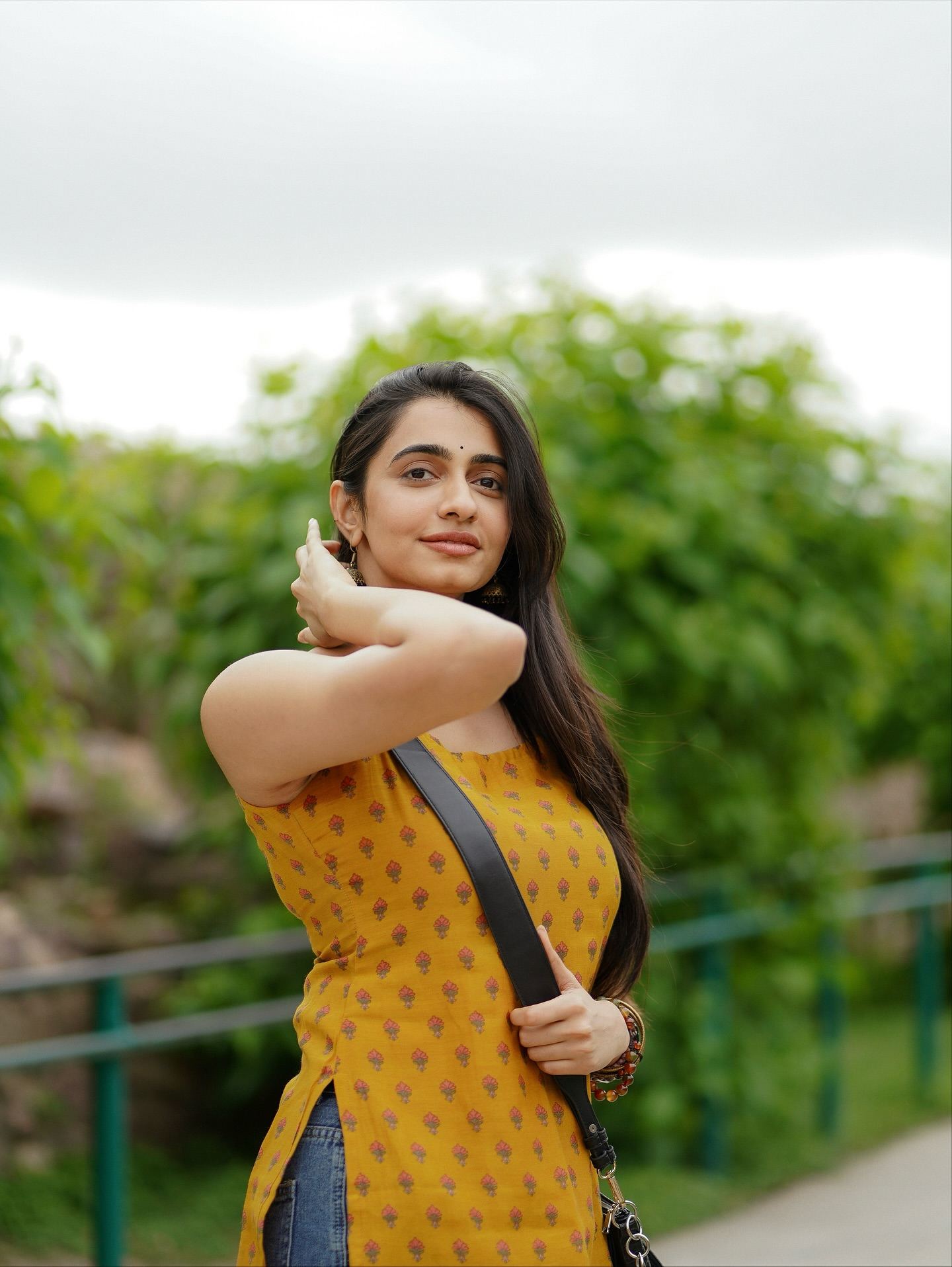 Maanasa Choudhary Candid Smile In Yellow