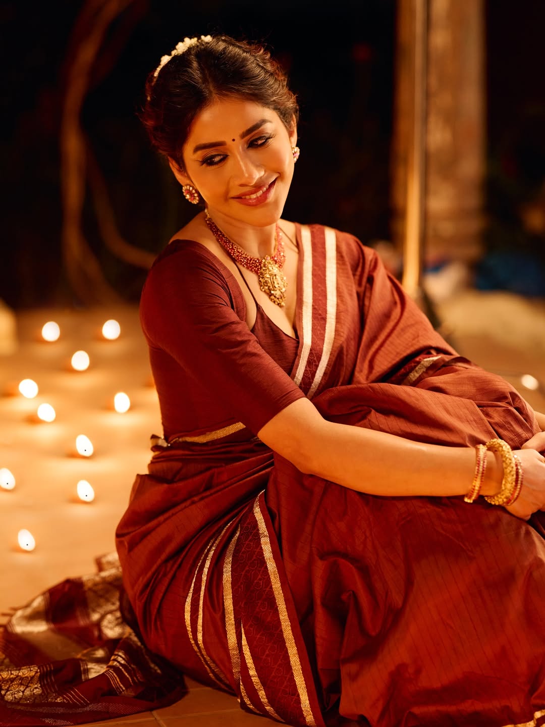 Nabha Natesh Surrounded By Glowing Diyas