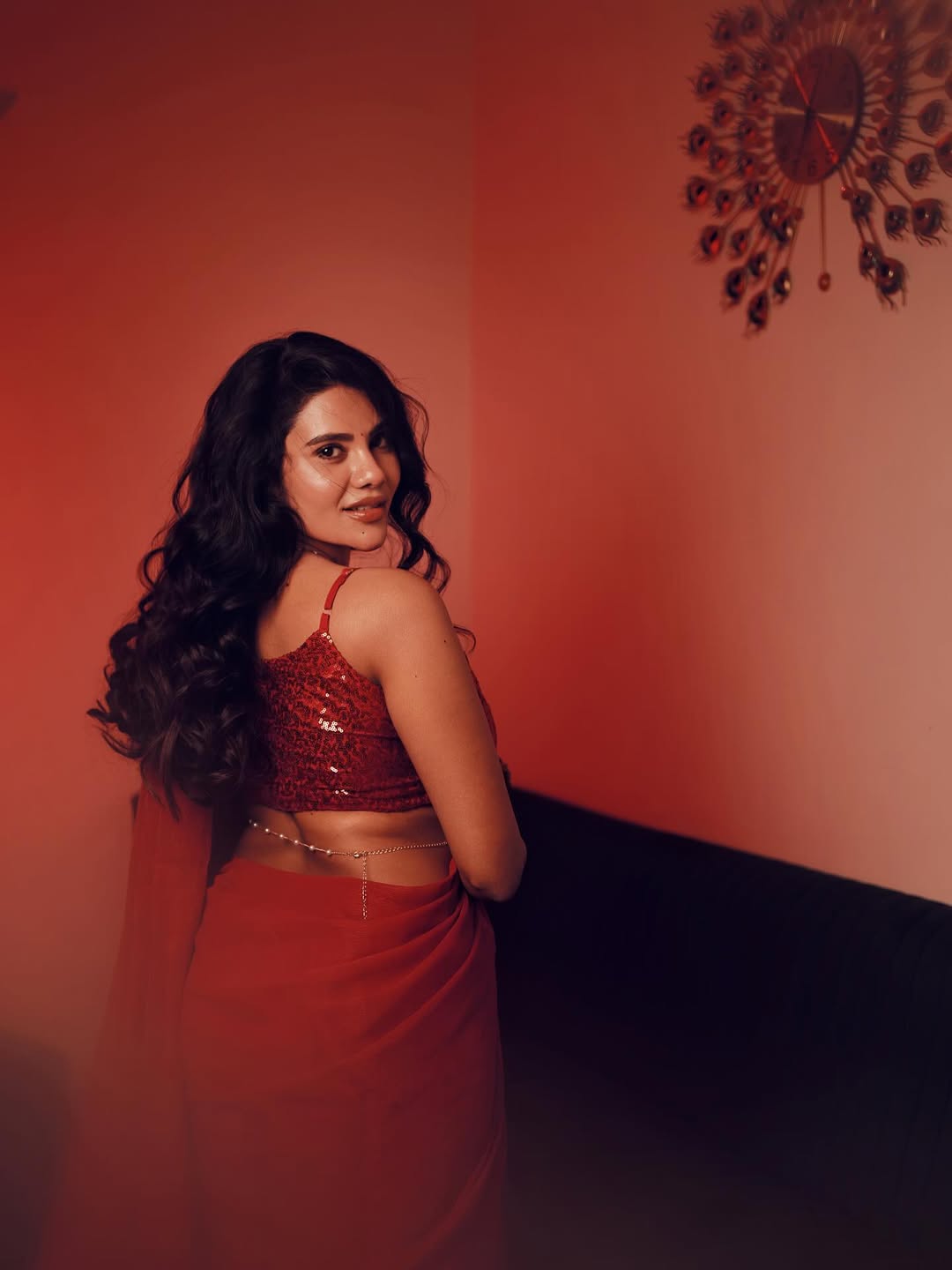 Nivisha Flaunts Curves In Red Saree Style