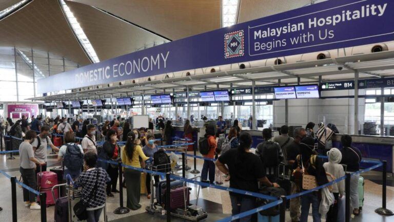 Passengers waiting after Malaysia flight cancellations