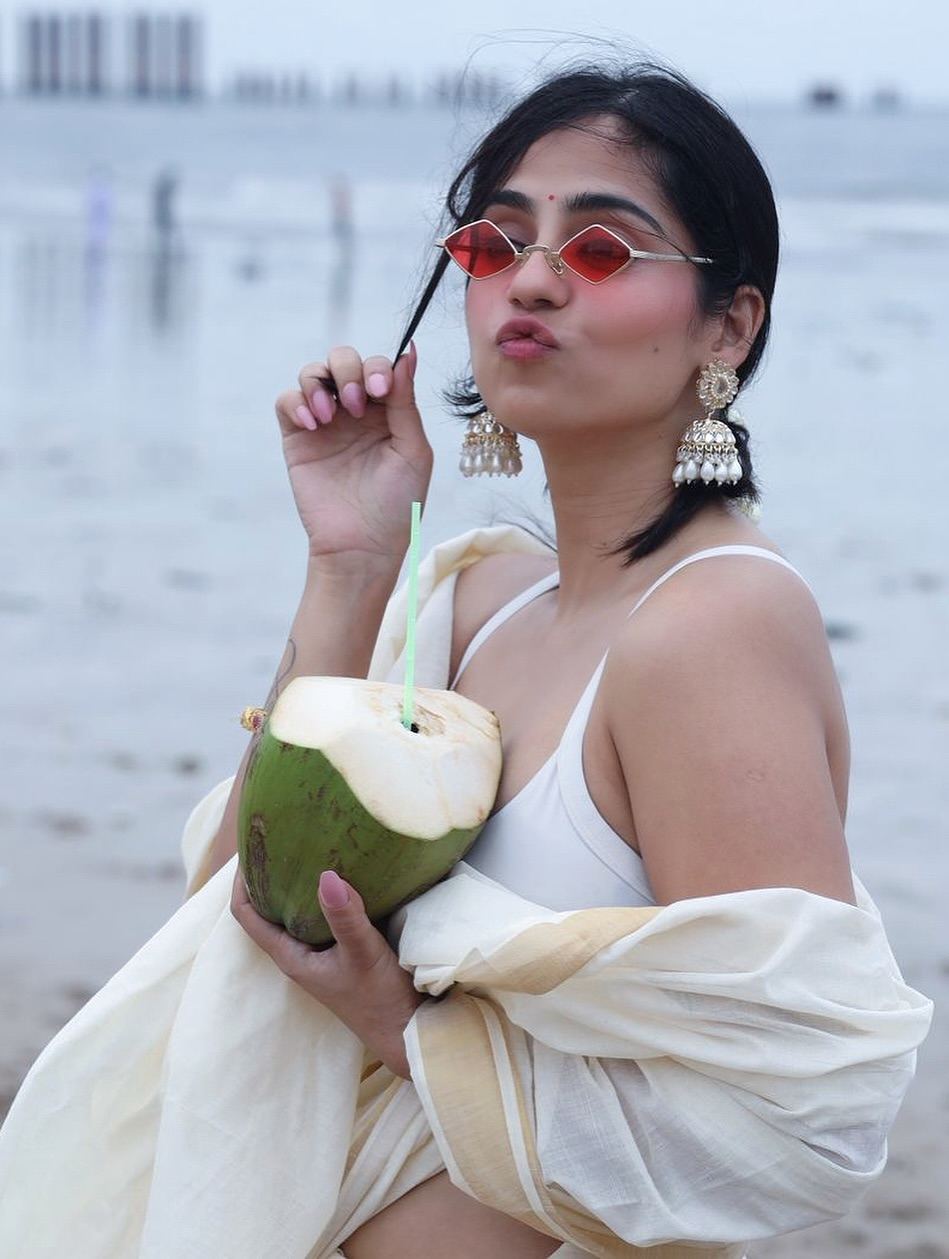 Playful Rose Sardana Posing with Coconut