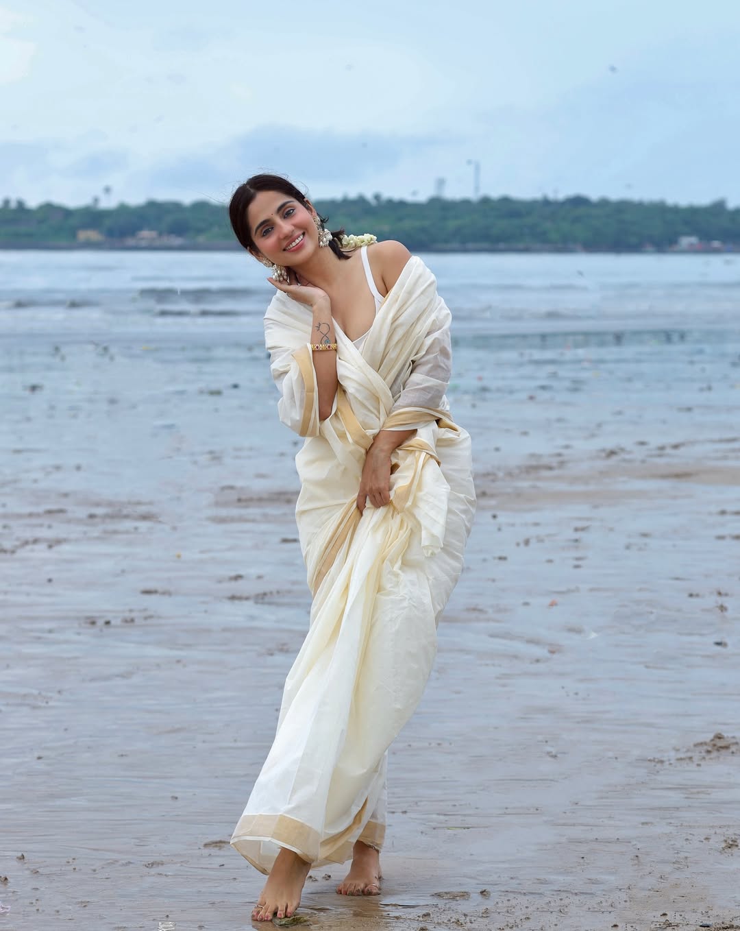 Rose Sardana In Serene Ivory Saree Pose