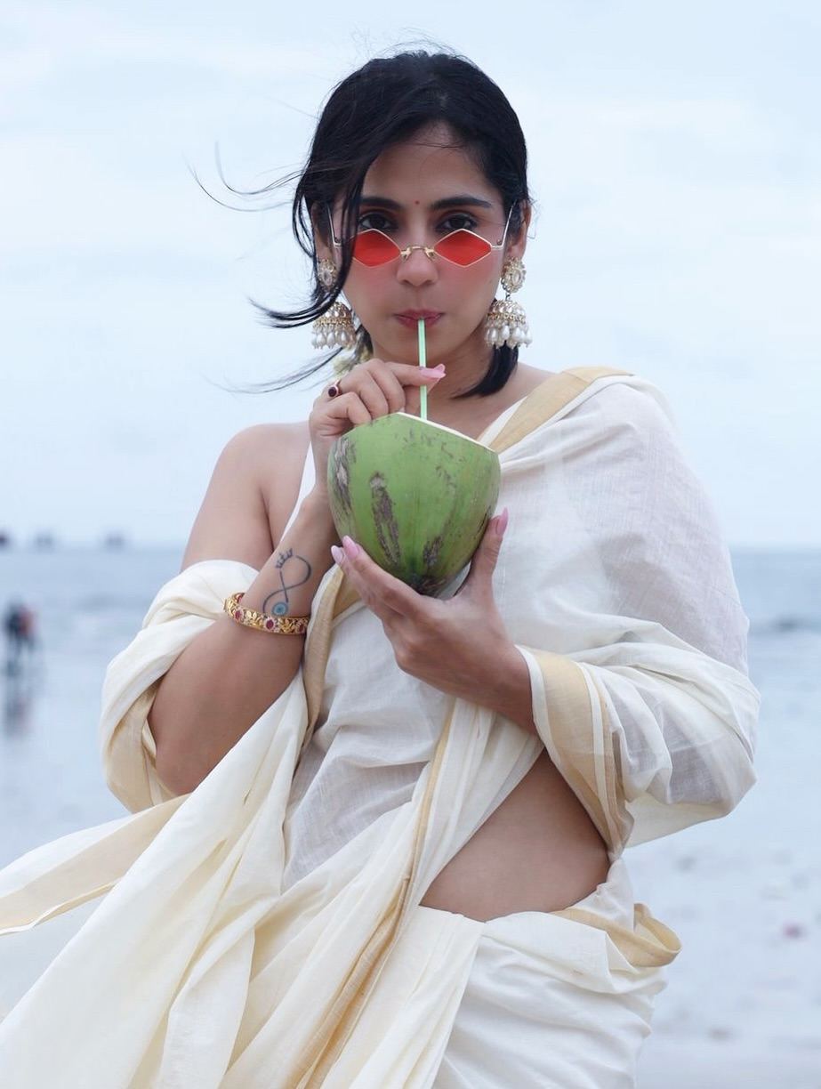 Rose Sardana Sipping Coconut by the Sea