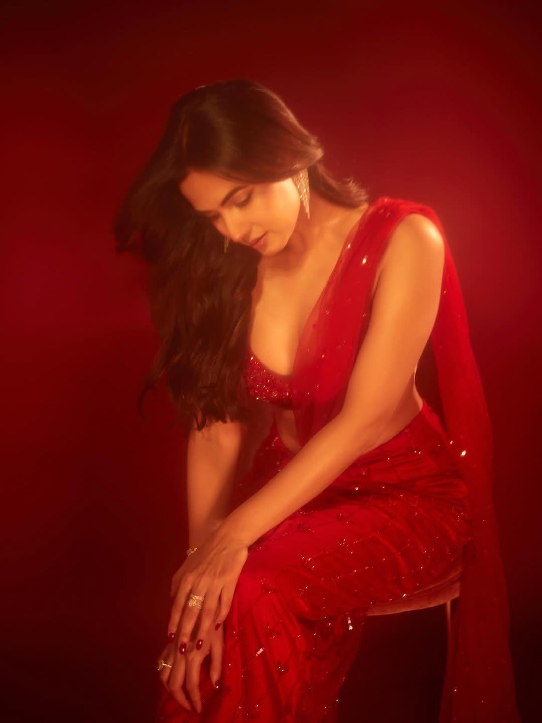 Sonal Chauhan Stuns In Scarlet Saree Glam