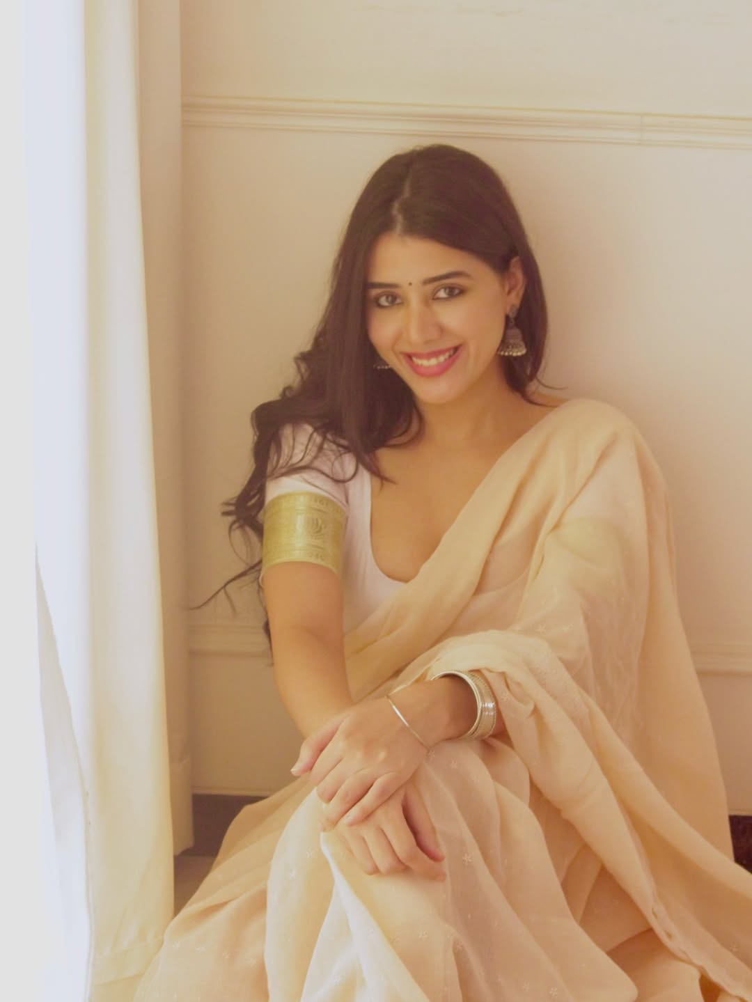 Aarti Chikara's Radiant Smile In A White Saree