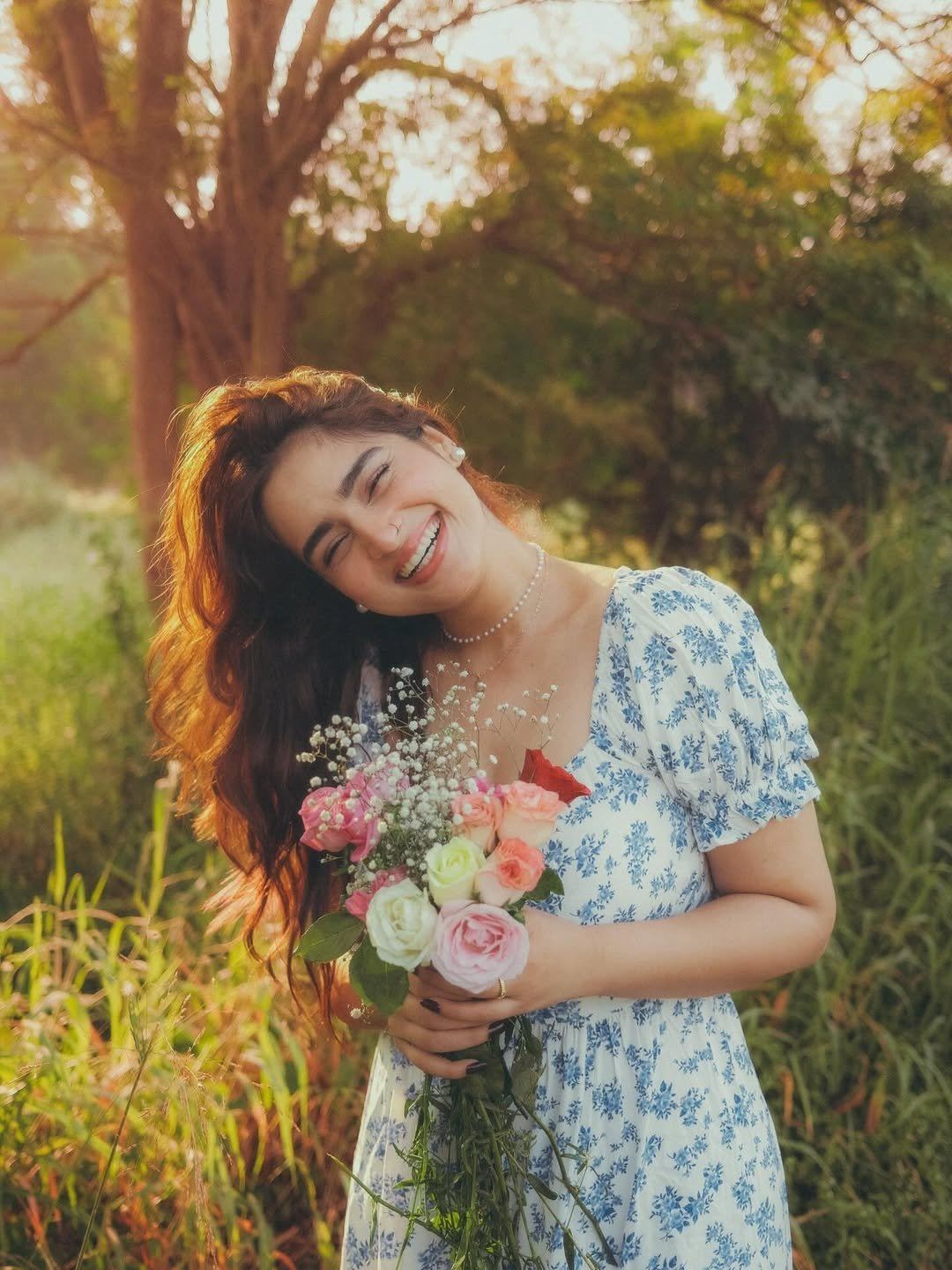 Ayesha Khan's Radiant Smile Holding Flowers