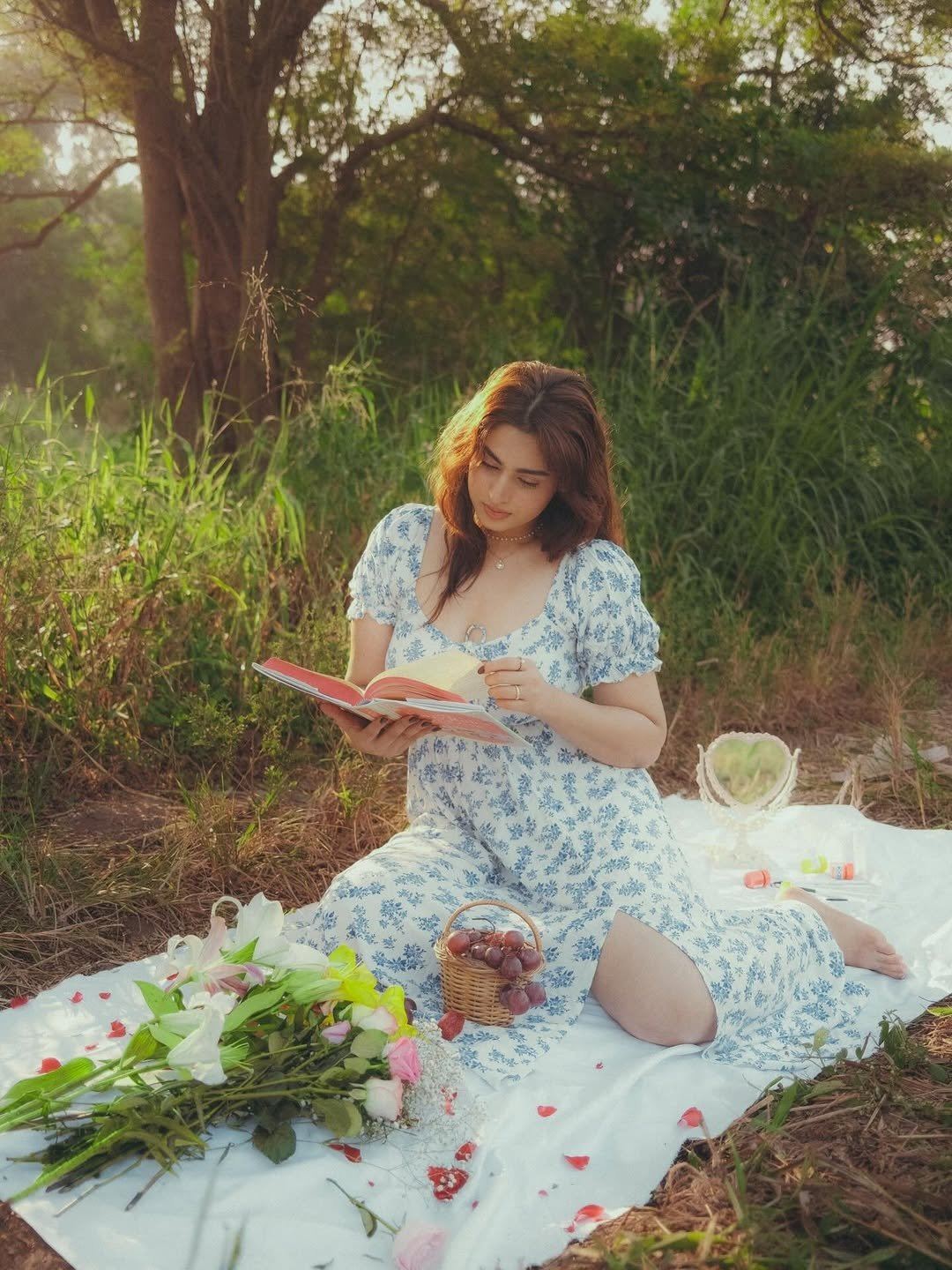 The Actress Poses Playfully With A Red Rose