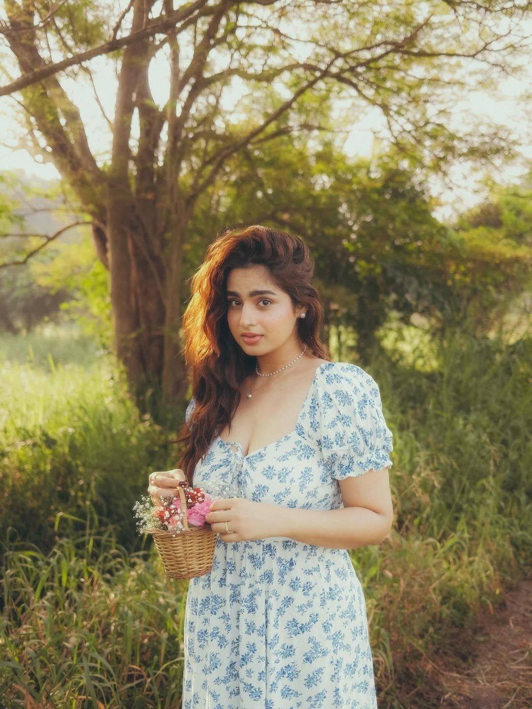 The Actress Wears A White Blue Floral Dress