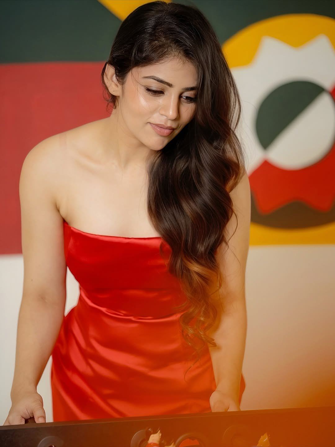 Bandhavi Sridhar Looks Away In A Red Strapless Top