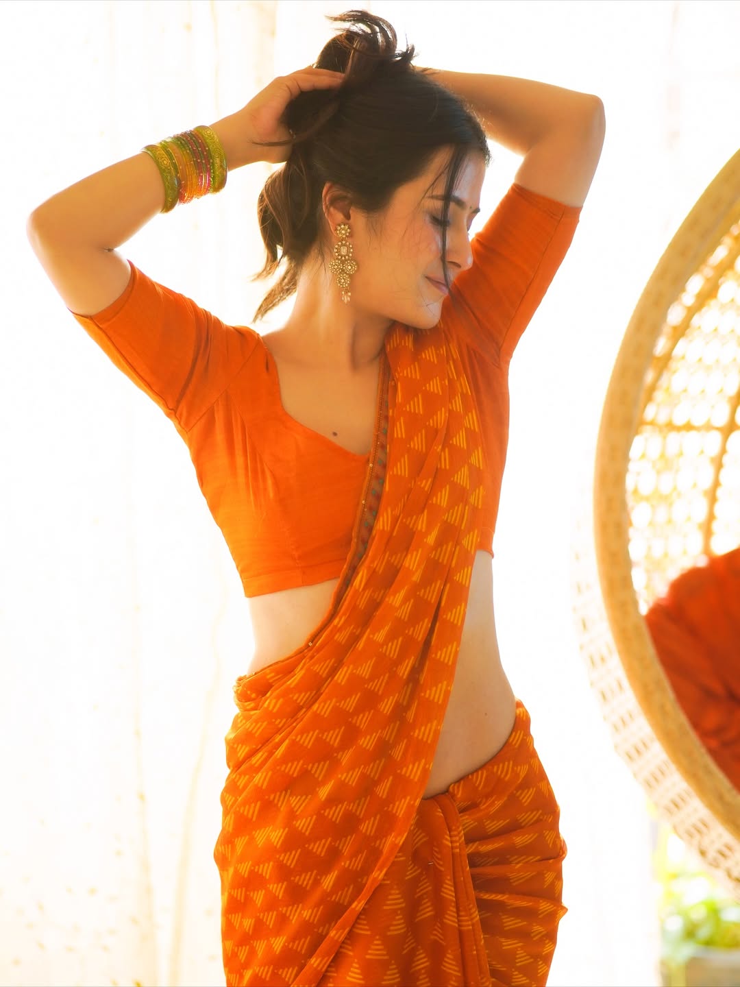 The Actress Poses With Hands In Her Hair