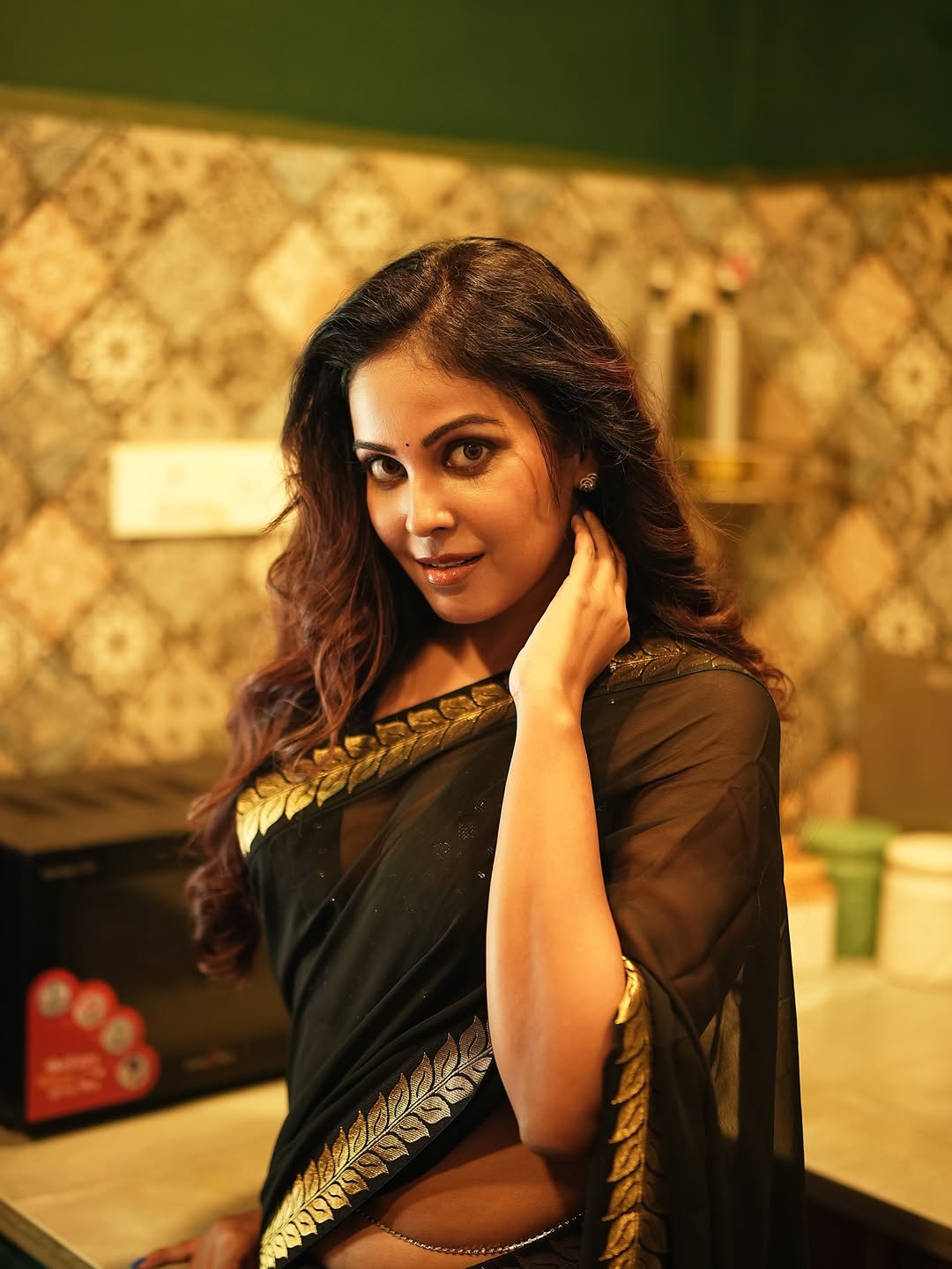 Chandni Tamilarasan's Confident Gaze In Black Saree