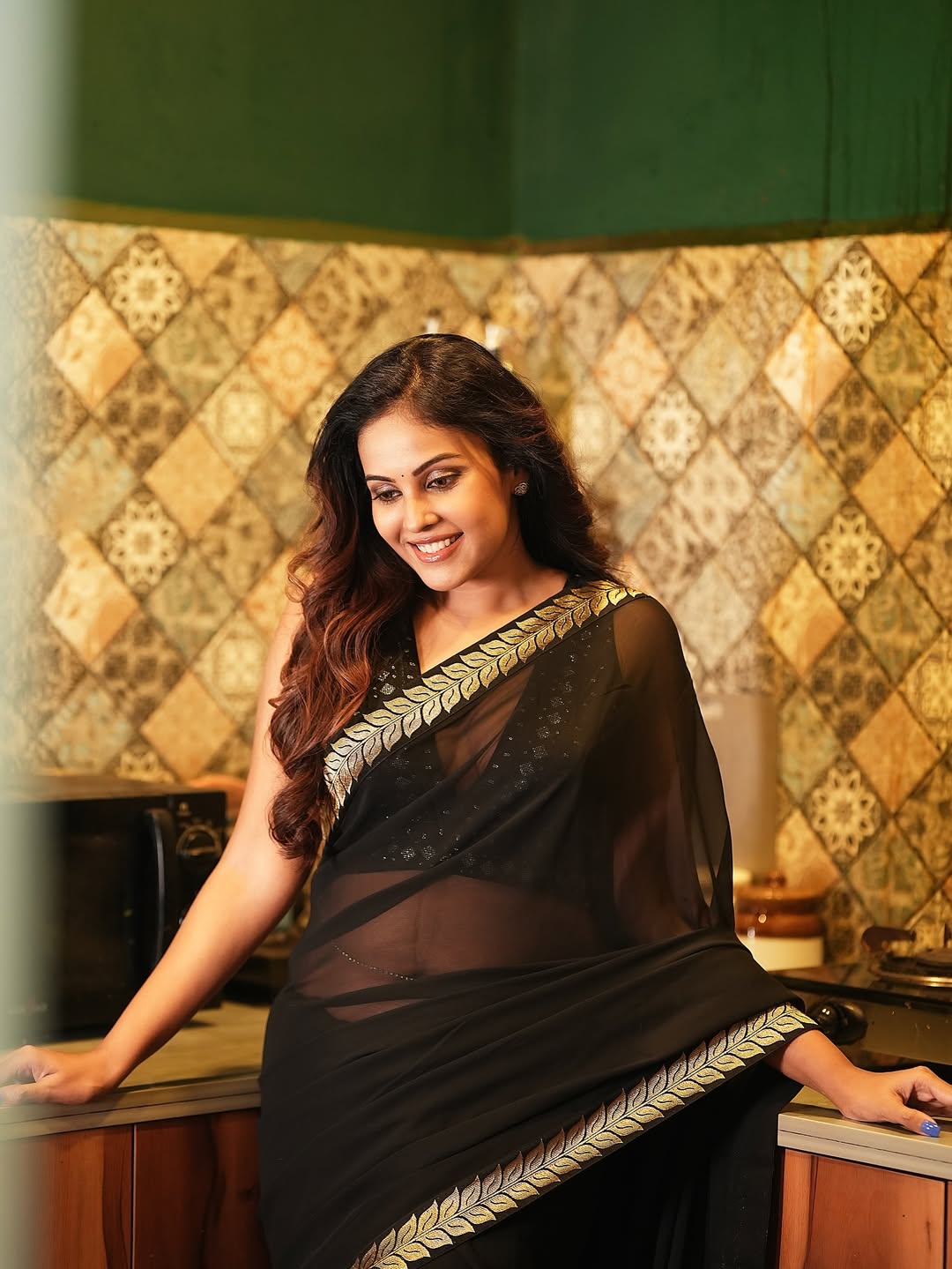 Chandni Tamilarasan Poses In A Kitchen Setting