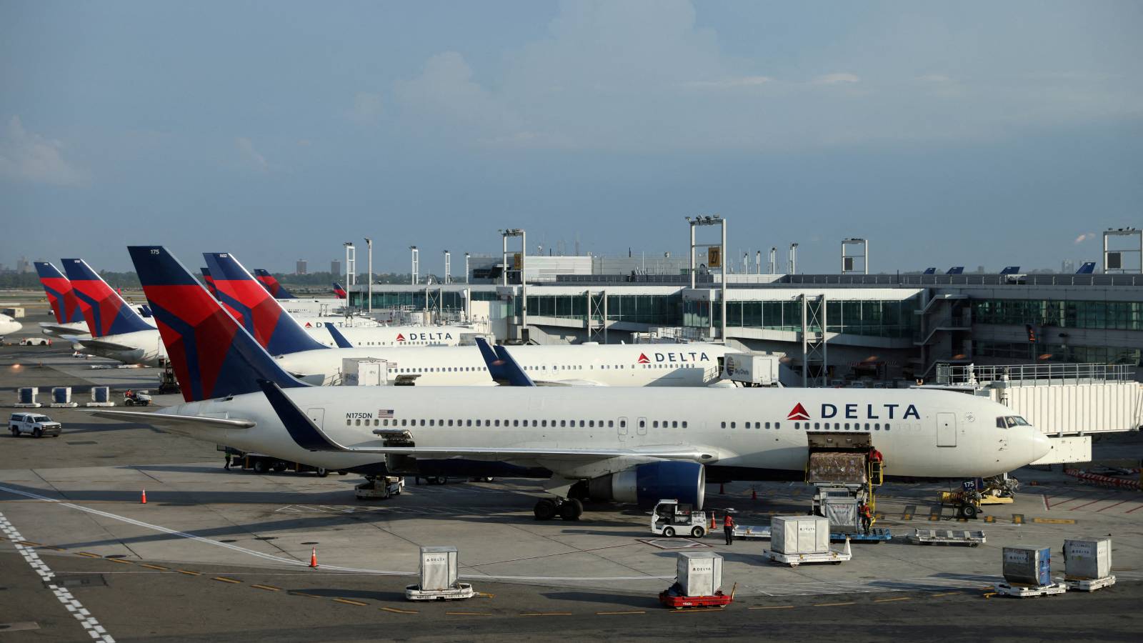Delta aircraft at airport terminal
