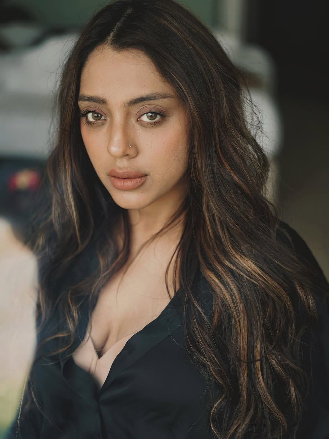 The Actress's Daring Unbuttoned Black Shirt