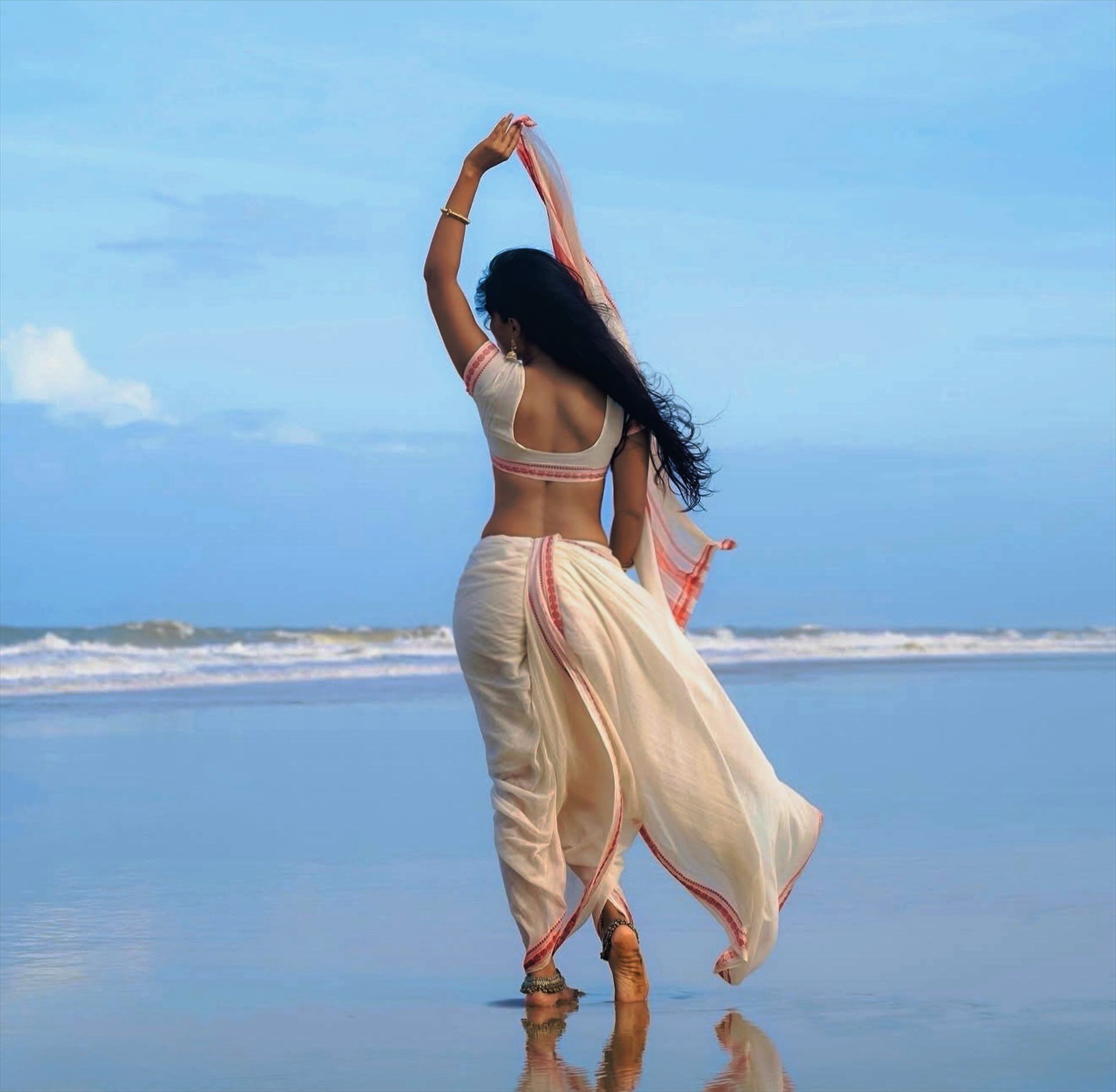 Back Pose Of Jyotipoorvaj In Flowing Saree