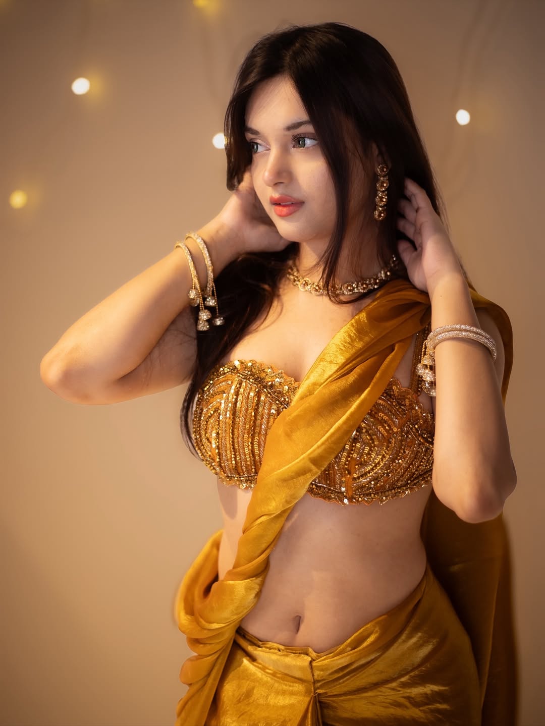 The Actress Poses With Hands In Her Hair